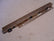 A-48300 Left Side Front Door Window Felt Holder- This is the metal piece that fastens to the inside front edge of the Slant Windshield 4 door, Victoria, and Slant Windshield Cabriolet doors that holds the felts, and the window frame bolts to it.